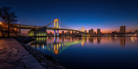 Naklejka premium Sunset reflection over rainbow bridge tokyo urban landscape photography peaceful water view