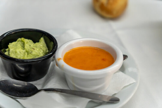 Lanzarote island  Canary Islands pdish Papas Arrugadas ( wrinkly potatoes) with Mojo picon (Red hot sauce) and Mojo verde ( Green sauce) on restaurant table
