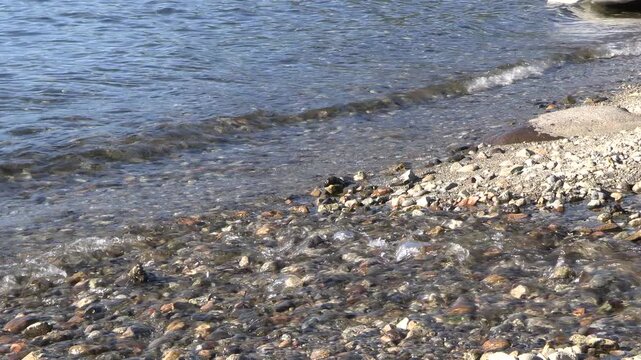 water and waves on the shore of lake caburgua, pucon, chile