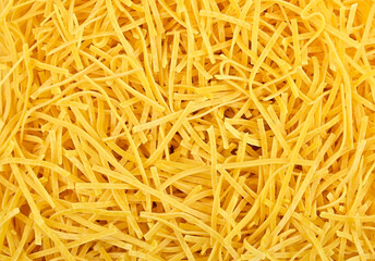 Tagliolini pasta as background