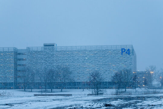 Parking garage building p4 during winter snowfall