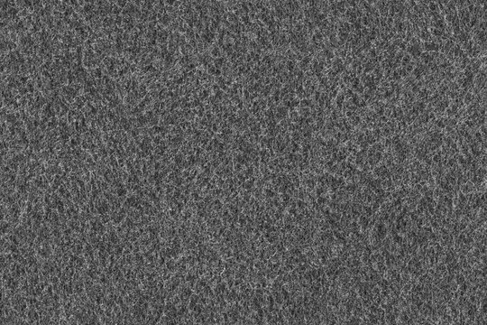 Black fabric material background texture. Seamless gray felt cloth fibre pattern.