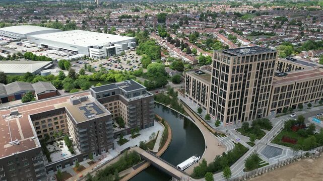 London, England - 2022, June 12: Two aerial drone shots edited together - a wide establishing view of the wider Greenford Quay development beside the Grand Union Canal