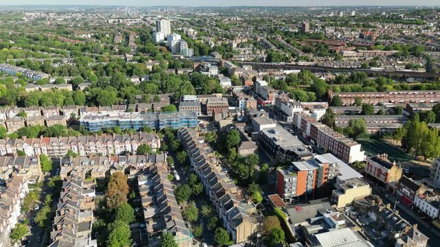 An aerial view of Kilburn, London, featuring the historic Gaumont State Theatre, showcasing the areas dense urban landscape.