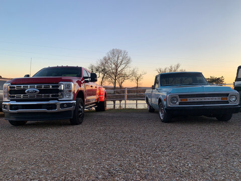 February 21, 2026, Pocola, Oklahoma, New Ford Truck and vintage Chevrolet Truck parked, showing compare and contrast in technology and styling