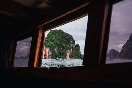 Traveling through phang nga bay seeing tropical islands from boat window