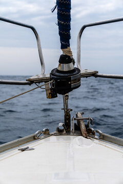 Sailboat bow with roller furler sailing on ocean
