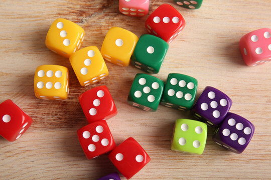 Colorful game dices on wooden background