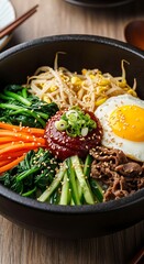 Delicious mixed rice dish topped with various vibrant ingredients and a fried egg is presented in a dark stone bowl