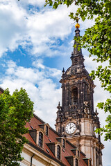 Dresden church tower framed by trees and sky