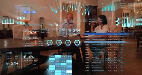 Reviewing couple in light shirt and white blouse examining papers at dining table, with AR overlays