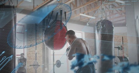 Striking shirtless man hitting round red-black bag in loft gym, with barbells and blue HUD overlays