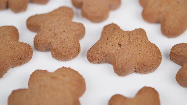 Gingerbread cookie details. Macro photograph highlighting gingerbread texture and edges. Intimate view showcasing detailed features of freshly baked gingerbread cookies
