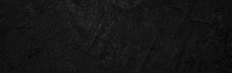 Obraz premium Panoramic Scary dark walls, slightly light black concrete cement texture for background