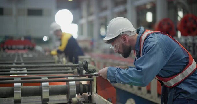 Metal workers use precise tools to verify dimensions during quality check and when setting up machines. Emphasizing accuracy, minimizing error, enhancing product quality in metal fabrication facility

