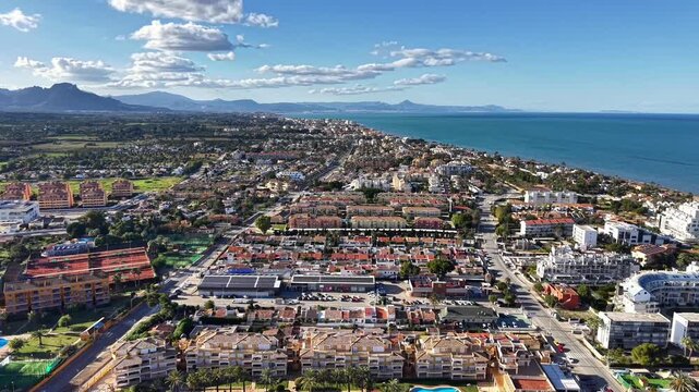 Aerial Suburb View Highlighting Solar Panels And Coastal Setting, Drone Footage For Sustainability Campaign,