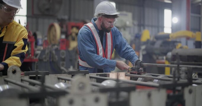 Metal workers use precise tools to verify dimensions during quality check and when setting up machines. Emphasizing accuracy, minimizing error, enhancing product quality in metal fabrication facility
