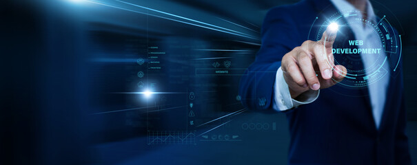 Fototapeta premium Businessman touching web development and network. Website creation, coding technology, digital platform, online business solutions, software innovation concept.