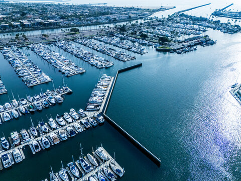 Wide aerial panorama of Long Beach harbor and marina with waterfront homes, yacht docks and Pacific coastline, real estate investment and coastal development concept