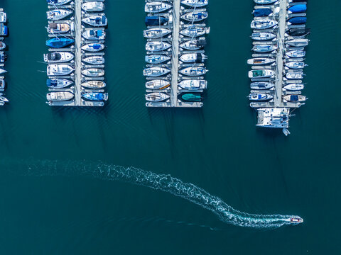 Wide aerial panorama of Long Beach harbor and marina with waterfront homes, yacht docks and Pacific coastline, real estate investment and coastal development concept