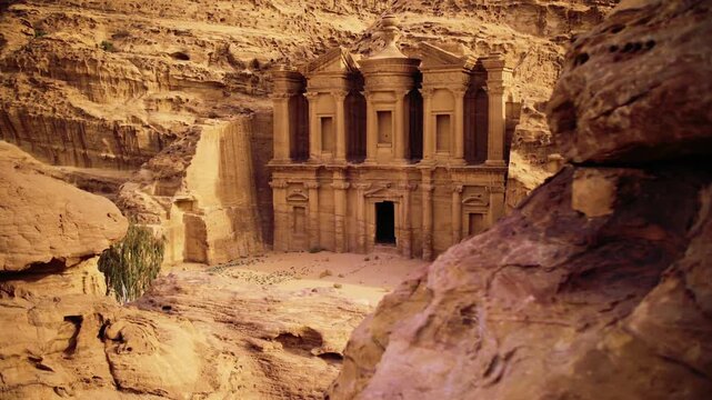 Al Dayr (The Monastery) in Petra, Jordan, monumental rock-cut sandstone fa&ccedil;ade, historic Nabataean site, dramatic desert cliffs, UNESCO World Heritage, ancient archaeological treasure.