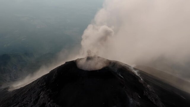 Aerial view of steam rising from Fuego Volcano crater over Guatemala.
