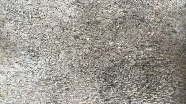 Texture concrete wall of light grey color cement texture background.Grey pastel rough crack cement texture stone concrete,rock plastered stucco; painted flat fade background. high angle, above, top.