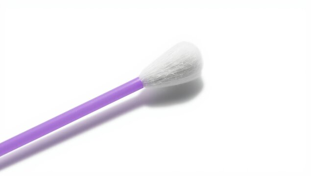 Detailed view of a cotton swab with a purple stick and shadow against a light backdrop