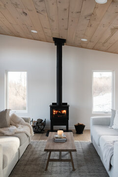 Interior of a getaway cabin with a cozy fire. 