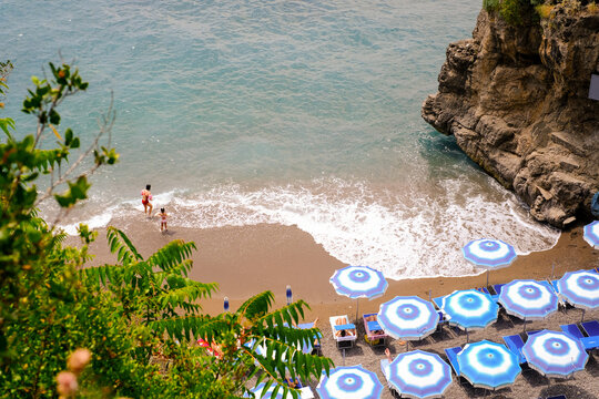 Mother and daughter on a beach in Amalfi coast, Italy