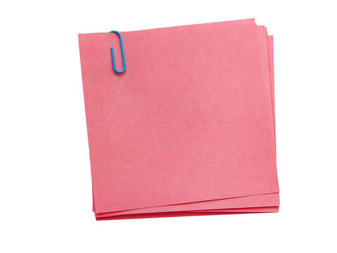 Pink sticky notes stack with blue paper clip mockup isolated on white. Blank pink memo notes with a blue paperclip, perfect for office reminders or creative templates.