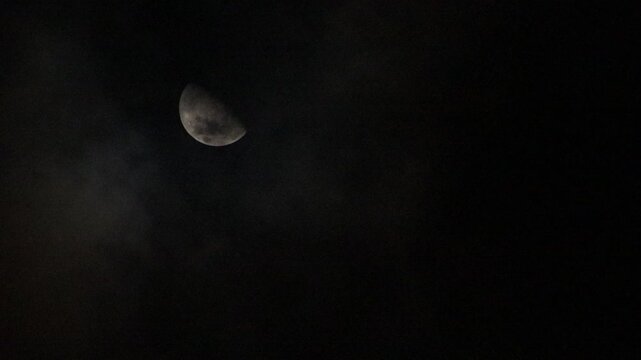 half moon and clouds at night