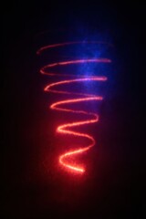 Obraz premium Abstract neon spiral of light swirling on a dark background for creative technology themes, scientific data visualization, meteorological study, and digital art projects