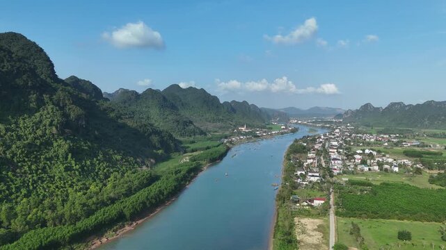 Phong Nha &ndash; Ke Bang National Park, Bo Trach, Quang Binh, Central Vietnam &ndash; 4K aerial footage of UNESCO Heritage site with Son River, limestone karst mountains, rice fields, tropical forest & cave