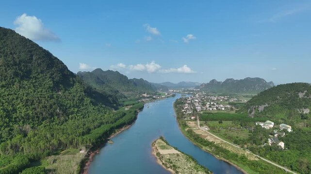 Phong Nha &ndash; Ke Bang National Park, Bo Trach, Quang Binh, Central Vietnam &ndash; 4K aerial footage of UNESCO Heritage site with Son River, limestone karst mountains, rice fields, tropical forest & cave