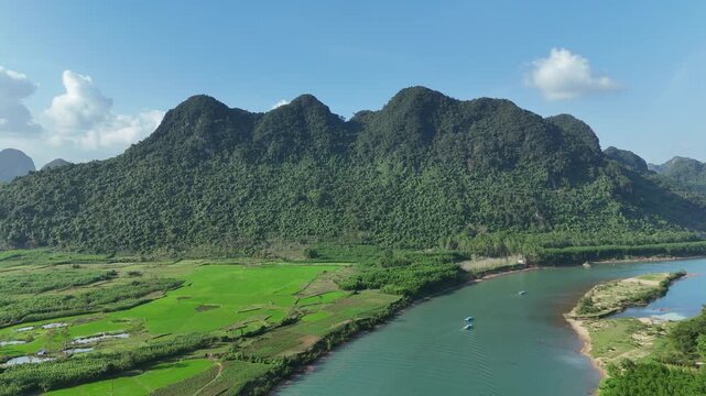 Phong Nha &ndash; Ke Bang National Park, Bo Trach, Quang Binh, Central Vietnam &ndash; 4K aerial footage of UNESCO Heritage site with Son River, limestone karst mountains, rice fields, tropical forest & cave