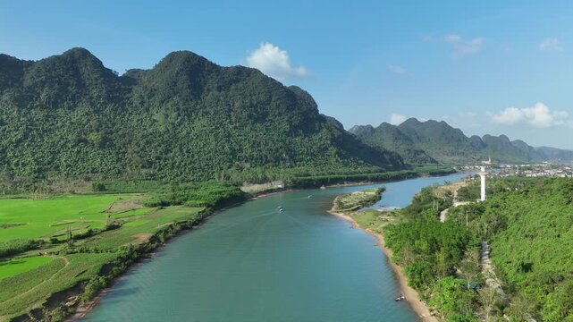Phong Nha &ndash; Ke Bang National Park, Bo Trach, Quang Binh, Central Vietnam &ndash; 4K aerial footage of UNESCO Heritage site with Son River, limestone karst mountains, rice fields, tropical forest & cave
