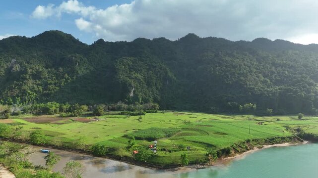 Phong Nha &ndash; Ke Bang National Park, Bo Trach, Quang Binh, Central Vietnam &ndash; 4K aerial footage of UNESCO Heritage site with Son River, limestone karst mountains, rice fields, tropical forest & cave