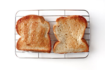 Golden Toast Bread on Wire Rack Isolated on White Background.