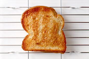 Golden Toast Bread on Wire Rack Isolated on White Background.
