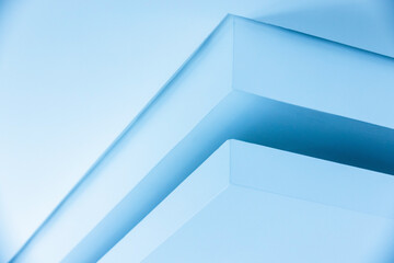 Abstract blue white composition of sharp ceiling beams and soft shadows. Minimal, geometric architecture creates calm, precise mood ideal for modern interior and design storytelling