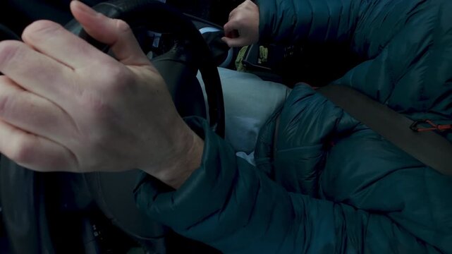 High angle close up of manual gear change inside left hand drive vehicle. Urban commute, road travel, and driving control concept.