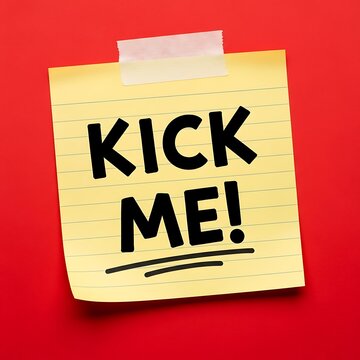 Humorous sticky note with 'kick me' message on red background, perfect for office prank or humoristic content