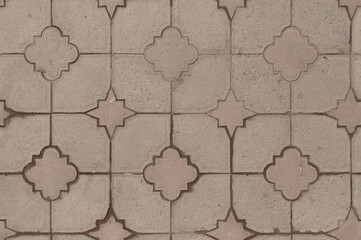 Decorative wall with geometric patterned tiles in neutral tones