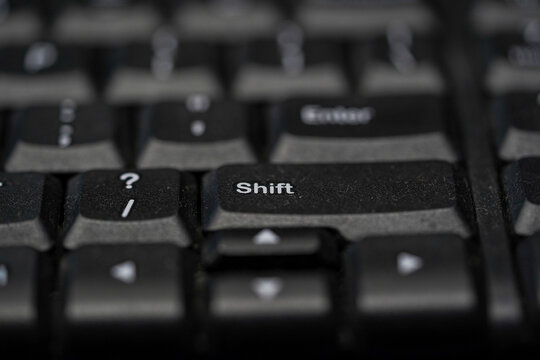 Macro Shot of a Black Computer Keyboard with Focus on the Shift and Enter Keys
