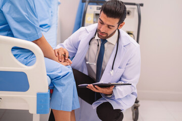doctor is talking to a patient in a hospital room