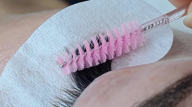Close up of female eye with eyelash extensions ,eyelash extension procedure.2d volume, 3d volume, classical lashes,Russian volume,mega volume, new set.