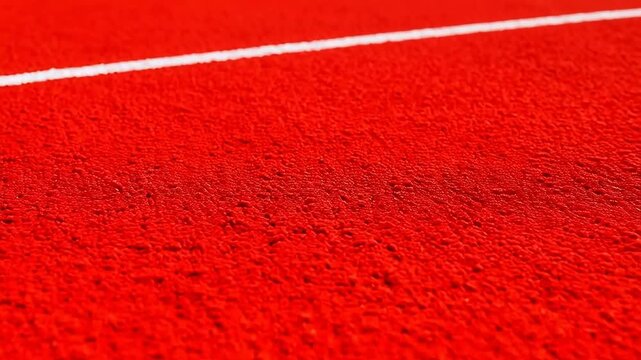 Red track surface with white line
