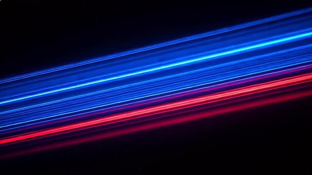 Blue and red light trails on dark background