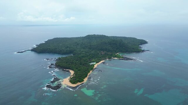 Aerial high view of Ilh&eacute;u das Rolas, an islet in the S&atilde;o Tom&eacute; and Pr&iacute;ncipe archipelago located in the Gulf of Guinea, south of the island. Of volcanic origin, it lies exactly on the Equator.Africa